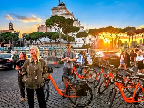 Cyclists riding past Piazza Navona on a fast Rome highlights bike tour